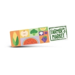 A rectangular sticker featuring colourful illustrations of various fruits and vegetables, including corn and watermelon, with a logo.