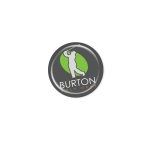 A circular resin-coated label featuring a logo in green and white on a dark background, with branding details.