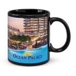 A coffee mug in black featuring a scenic image of a hotel and pool, with a logo on the front.