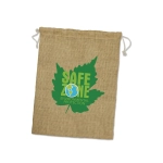 A large jute gift bag in natural beige with a green leaf design and a logo.