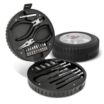 A circular toolkit in a black tyre-shaped case, featuring pliers, screwdriver bits, and various tools.
