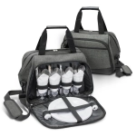 A grey picnic bag with cutlery, glasses, and plates neatly arranged inside. It has two handles and an adjustable strap.