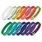 A collection of silicone wristbands in various colours, featuring debossed text and logos.