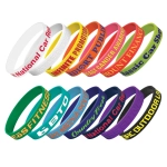 A collection of embossed silicone wristbands in various colours, each featuring different text and a logo.