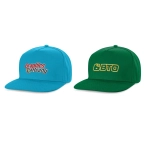 Two flat peak caps: one in blue with a logo and one in green with a different logo.