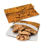 An orange reusable snack pouch with a floral design, containing chocolate chip cookies inside.