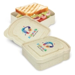 A light beige sandwich box with a logo, containing a sandwich, lettuce, and sliced meats.