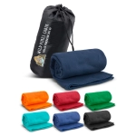 A fleece blanket in navy blue, rolled and packed in a black carry bag, with other blankets in various colours displayed beside it.