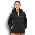 A women's black softshell jacket with a hood, featuring zip pockets and a small logo.