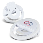 A white selfie phone light with a circular design, featuring a logo on the front and a clip for attachment.