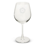 A clear wine glass with a stem, featuring an intricate logo design on the front.