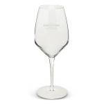 A clear glass wine glass with a tall, elegant design and a branded logo on the surface.