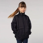 A windbreaker jacket for kids in black, featuring a high collar and a loose fit. It has a logo on the front.