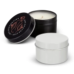 A black tin candle with a lid and a white tin candle, both showcasing a simple, elegant design.