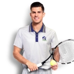 A man wearing a light grey tennis top with coloured stripes, holding a tennis racquet and a ball. The top has a logo.