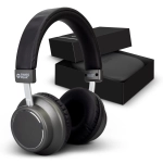 A pair of grey wireless headphones with a black cushioned headband, accompanied by a black box.