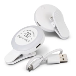 A white selfie light with a clip and USB charging cable, designed for mobile phones. It features a branded logo.
