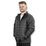 A unisex black puffer jacket with a zip front and pockets worn by a model against a plain background.