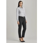 A model wears women's slim leg pants in black, paired with a light grey shirt and black heels. Features branding on the pants.