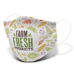 A large reusable face mask featuring a colourful pattern of vegetables with a logo.