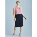 A lined skirt in navy paired with a pink top, featuring a relaxed fit and a subtle pleat detail.