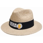 A natural straw hat with a black band and a logo. The hat has a wide brim and a classic style.