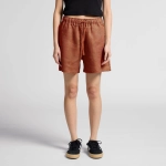 A pair of rust-coloured linen shorts with an elastic waistband and drawstring, featuring two side pockets.