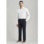 Men's slimline pants in navy blue, paired with a white shirt and brown shoes, featuring a logo on the waistband.