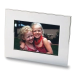 A nickel-plated photo frame featuring a vibrant image of two smiling girls with curly hair.