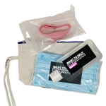 A wellness bundle including a blue face mask, hand sanitiser in a clear bottle, and a pink hair tie in a pouch.