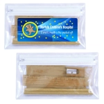 A clear pencil case containing a yellow ruler, a sharpener, and additional stationery items. It features a logo.