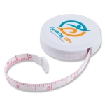 A white tape measure with a pink measuring tape, featuring a logo on the lid.