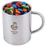 A stainless steel mug filled with colorful M&M's candies, featuring a logo that reads "Mothers Day Appeal."