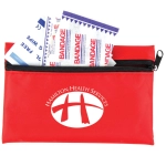 A red first aid kit containing bandages, with a zipper closure and a logo on the front.