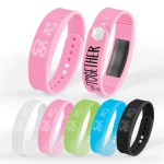A collection of Stride Pedometer Bracelets in pink, blue, green, black, white, and transparent designs, featuring digital displays.
