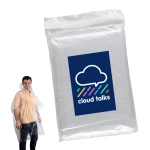 A man wearing a transparent poncho stands next to packaging featuring a logo. The poncho is lightweight and waterproof.