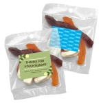A clear packet of mixed lollies featuring jelly shapes in vibrant colours. Includes a logo and a decorative label.