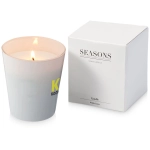 A grey scented candle in a frosted glass holder, accompanied by a white box. The candle is burning, revealing a soft glow.