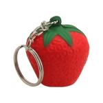 A vibrant red stress strawberry key ring with a green top and a silver keychain attachment.