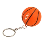 An orange basketball key ring with black stripes and a metal chain attachment, featuring a small logo.