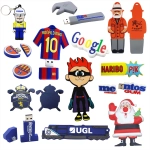 A collection of colourful custom USB flash drives in various shapes, including figures, logos, and themed designs.