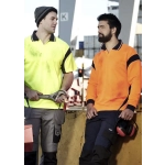 Two men wearing short-sleeve polo shirts in bright yellow and orange, featuring logos and workwear-style designs.