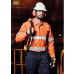 An orange work shirt with reflective tape, worn by a man holding a tool, accompanied by a safety helmet and gloves.