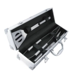 A BBQ set in a silver case, featuring a spatula, tongs, and a fork, with black accents.