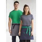 A green and navy urban waist apron worn by two models, featuring contrasting ties and a logo on one apron.