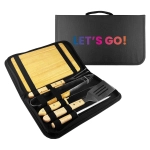 A BBQ set featuring stainless steel tools with wooden handles, arranged in a black carrying case.