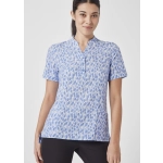 A women's tunic in blue and white with a stardust print, featuring a collar and short sleeves. It has a logo.