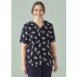 A navy scrub top featuring various printed cartoon animals. The top has a V-neck design and a logo on the sleeve.