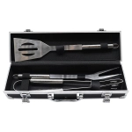 A stainless steel BBQ set with spatula, fork, and tongs in a sleek black deluxe case.