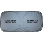 A grey sunshade with two circular cutouts and a prominent logo.